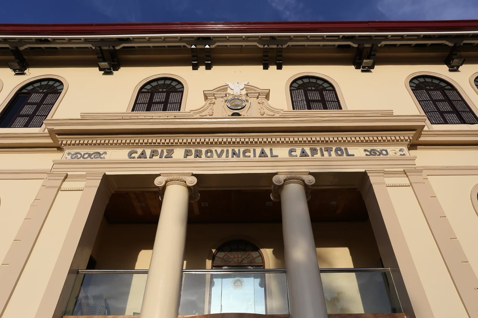 Facade of the Capiz Provincial Capitol in Roxas City, with Ionic columns and capiz-pane windows